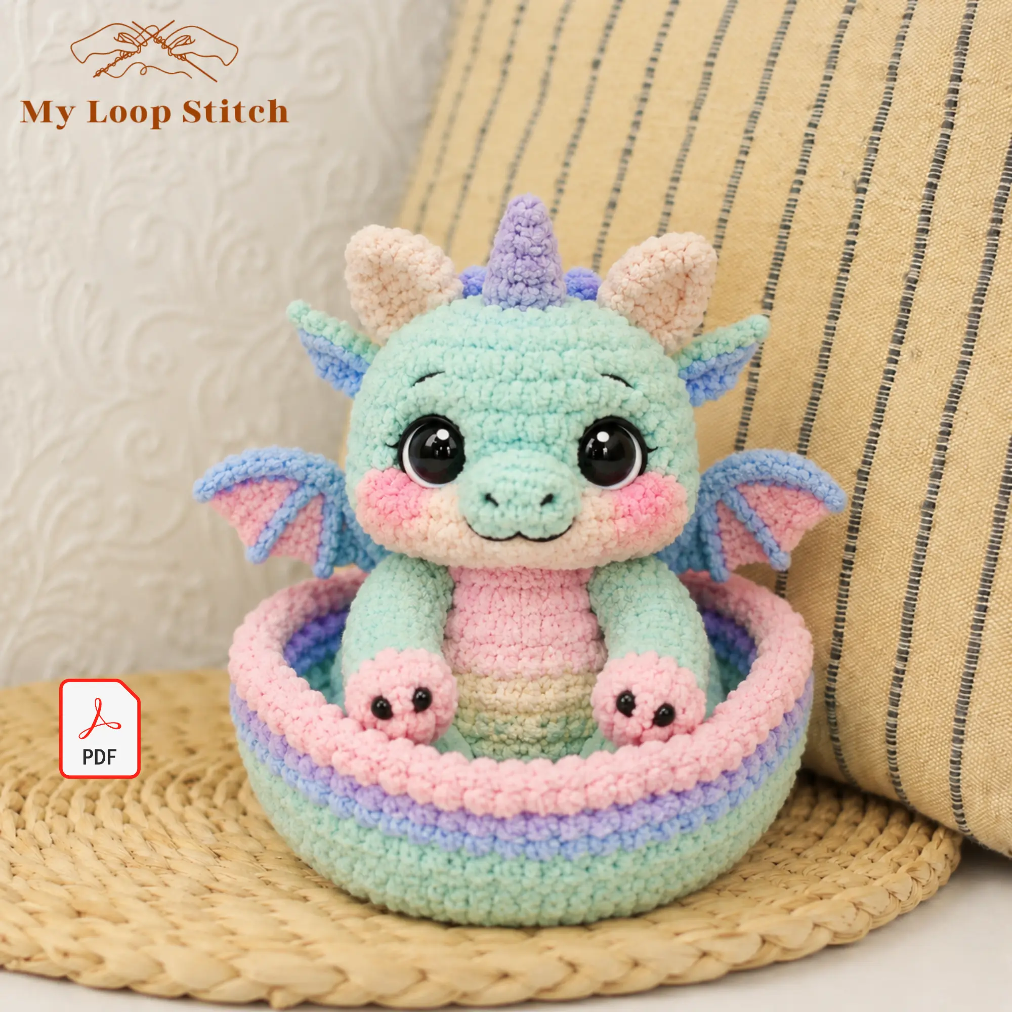 Dragon Amigurumi Pattern PDF – Pastel Baby Dragon in a Basket Pastel baby dragon amigurumi with lavender horn, pink paws and blue-and-pink wings sitting in a crocheted basket